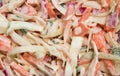 Full frame closeup of isolated cole slaw made of white raw cabbage, red onions, carrots, green parsley and mayonnaise sauce Royalty Free Stock Photo