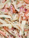 Full frame closeup of isolated cole slaw made of white raw cabbage, red onions, carrots, green parsley and mayonnaise sauce Royalty Free Stock Photo