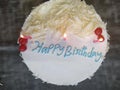 White birthday cake with lit candles Royalty Free Stock Photo