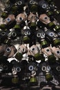 A full frame dark image of rows of gas masks with bright green filters on them and blue glass eyepieces