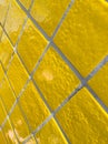 Full frame detail of yellow tiled wall