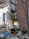 Full frame image of a wrecked collapsing building being demolished with smashed brick walls and rubble