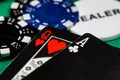 A full frame macro of an Ace of clubs and a Queen of hearts from a unique black faced deck of cards with black and blue betting Royalty Free Stock Photo