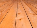 Full frame perspective view of old worn timber planking with a grainy textured surface used for flooring