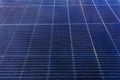 Full frame of photovoltaic solar panels showing geometric pattern and dark blue reflective surface Royalty Free Stock Photo