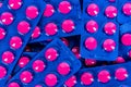 Full frame of pile of ibuprofen in pink tablet pills pack in blue blister packaging. Ibuprofen for relief pain, headache Royalty Free Stock Photo