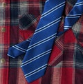 Full frame of plaid shirt and blue necktie for Fathers Day holiday background Royalty Free Stock Photo