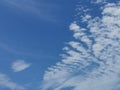 Full frame of pretty blue sky with unusual scudding cloud formation Royalty Free Stock Photo