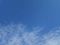 Full frame of pretty blue sky with unusual scudding cloud formation Royalty Free Stock Photo