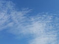 Full frame of pretty blue sky with unusual scudding cloud formation Royalty Free Stock Photo