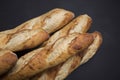 Hand made French bread selection on black background with copy area. Royalty Free Stock Photo