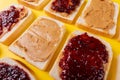 Full frame shot of bread slices with preserves and peanut butter arranged alternatively