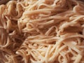 Full frame shot of delicious healthy homemade noodles (taglierini) pasta. Good as a background. Royalty Free Stock Photo