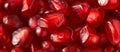 Full frame shot of pomegranate seeds. Abstract photo of a close-up of neatly arranged pomegranate seeds. Background texture of a