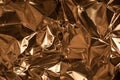 Full frame take of a sheeT of crumpled gold aluminum foil Royalty Free Stock Photo