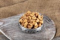 Full frame top view of large amount of raw delicious cashews placed on smooth surface. Pile of shelled cashew nuts in copper bowl Royalty Free Stock Photo