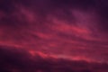 Full frame view heavy sky cloudscape bright pink violet colors