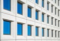 full frame view of modern white house with blue windows