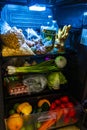 Full fridge with everything you need fruit vegetables drinks beer Mexico