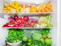 Full fridge with vegetables and fruit