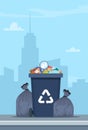 Full garbage bin and black plastic trash bags around. Overflowing recycling container with trash. Black recycle can. Street dump