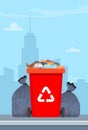 Full garbage bin and black plastic trash bags around. Overflowing recycling container with trash. Red recycle can. Street dump