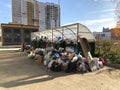 Full garbage bin in the city, a pile of waste. Environmental pollution in Russia