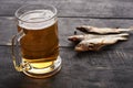 full glass of beer and a fish on the table Royalty Free Stock Photo
