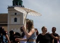 Full Gospel Church Christian Community evangelist female dancing with an umbrella in Warsaw, Poland - May 28, 2023