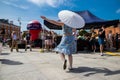 Full Gospel Church Christian Community evangelist female dancing with an umbrella in Warsaw, Poland - May 28, 2023