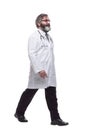 In full growth. confident male doctor striding forward. Royalty Free Stock Photo