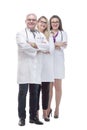 In full growth. a friendly female doctor standing in front of her colleagues. Royalty Free Stock Photo