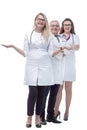 In full growth. a friendly female doctor standing in front of her colleagues. Royalty Free Stock Photo