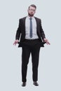 in full growth. frustrated businessman showing his empty pockets Royalty Free Stock Photo