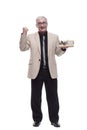 in full growth. Mature intelligent man with a gift box. Royalty Free Stock Photo