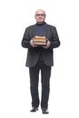 in full growth. senior business man with a stack of books Royalty Free Stock Photo