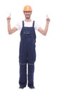 In full growth. smiling man in overalls pointing somewhere up Royalty Free Stock Photo