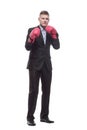 in full growth. young businessman in Boxing gloves. Royalty Free Stock Photo