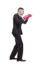 in full growth. young businessman in Boxing gloves.