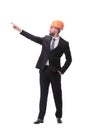 In full growth. young businessman in helmet pointing to copy space Royalty Free Stock Photo