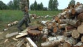 Full HD footage of a man choping firewood with axe