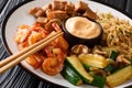 Full hibachi dish with rice, shrimp, steak and vegetables served with sauce closeup in a plate. horizontal Royalty Free Stock Photo