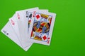 Full house hand of cards on bright green flat lay in a game of texas holdem poker gambling at a casino concept Royalty Free Stock Photo
