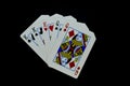 Full house kings over queens cards in poker game against black background Royalty Free Stock Photo