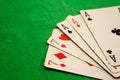 Full house poker cards combination on green background casino luck fortune