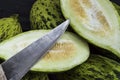 Full immature small melons, raw melon pictures, cut a small melon with a knife, eat an immature melon, immature small melons,
