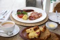 A full Irish breakfast consisting of bacon, egg, sausage, black pudding and grilled tomato. Royalty Free Stock Photo