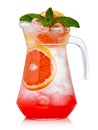 Full jug of fresh nonalcoholic cocktail with grapefruit and green mint