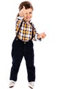 Full lenght portrait of an adorable little boy showing thumbs up Royalty Free Stock Photo