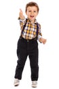 Full lenght portrait of an adorable little boy showing thumbs up Royalty Free Stock Photo